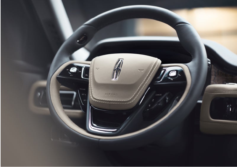 The intuitively placed controls of the steering wheel on a 2023 Lincoln Aviator® SUV | Magic City Lincoln in Roanoke VA