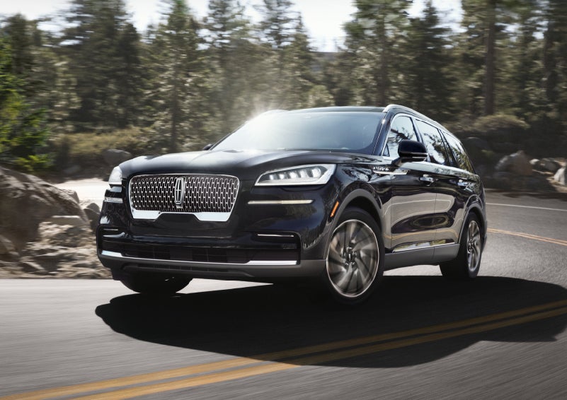 A Lincoln Aviator® SUV is being driven on a winding mountain road | Magic City Lincoln in Roanoke VA