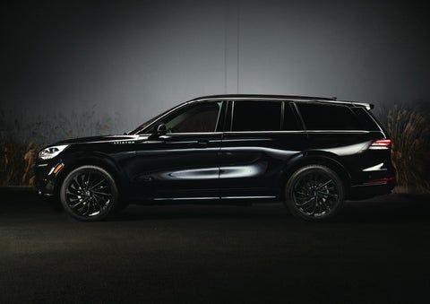 A 2024 Lincoln Aviator® SUV is shown in the Infinite Black exterior color | Magic City Lincoln in Roanoke VA