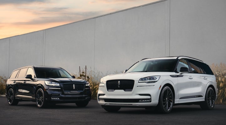 Two Lincoln Aviator® SUVs are shown with the available Jet Appearance Package | Magic City Lincoln in Roanoke VA