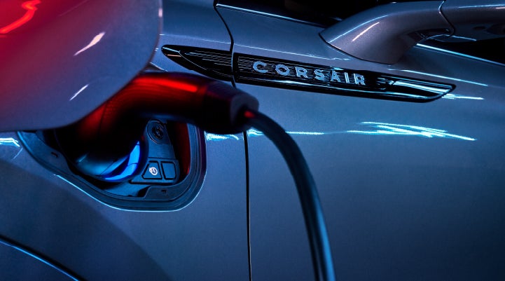 A charger plugged into the charging port of a 2024 Lincoln Corsair® Plug-in Hybrid model. | Magic City Lincoln in Roanoke VA