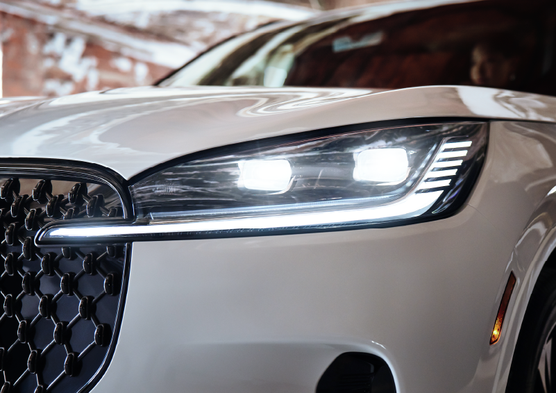 A close-up of a headlamp on the 2025 Lincoln Aviator® SUV is shown. | Magic City Lincoln in Roanoke VA