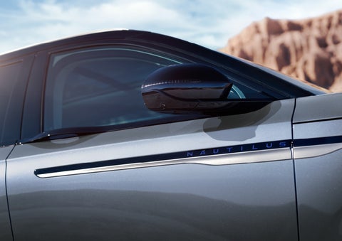 Blue lettering on the side of the vehicle that reads nautilus indicates the available hybrid powertrain. | Magic City Lincoln in Roanoke VA