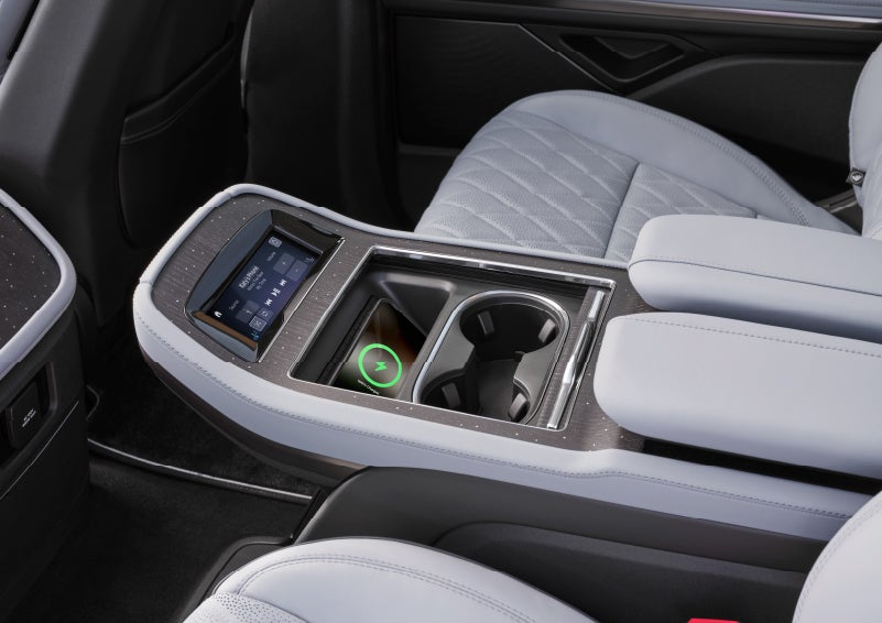 A couple is relaxing inside their quiet and serene 2025 Lincoln Navigator® SUV