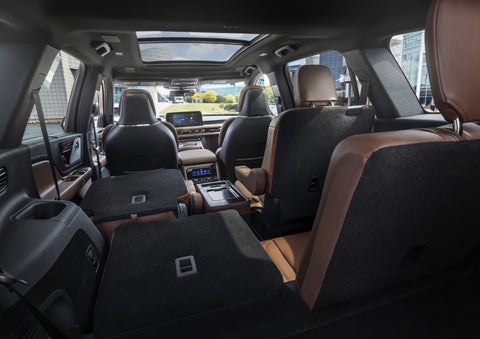 One side of the PowerFold® third-row seat and a second-row seat are folded forward in the 2026 Lincoln Aviator® SUV. | Magic City Lincoln in Roanoke VA