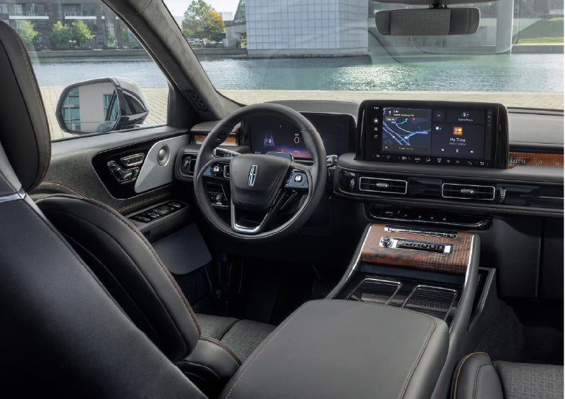 The interior of the 2026 Lincoln Aviator® SUV is shown parked with a view of a harbor through the windshield. | Magic City Lincoln in Roanoke VA