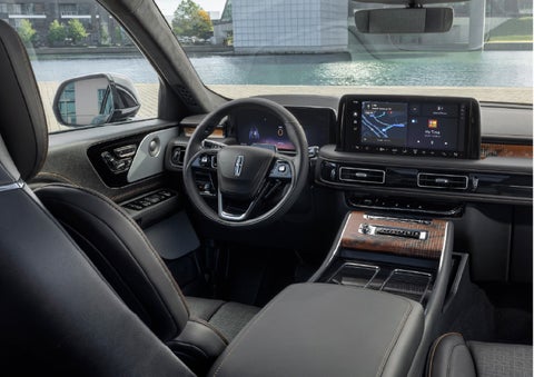 The interior of the 2026 Lincoln Aviator® SUV is shown parked with a view of a harbor through the windshield. | Magic City Lincoln in Roanoke VA
