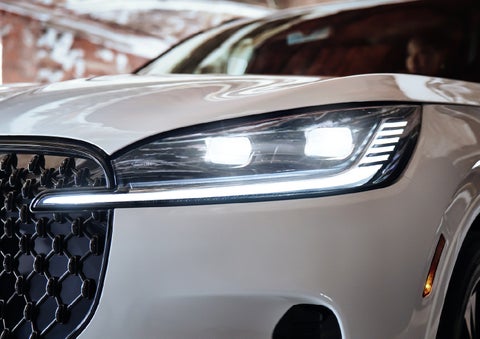 A close-up of a headlamp on the 2027 Lincoln Aviator® SUV is shown. | Magic City Lincoln in Roanoke VA
