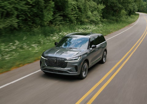 A 2027 Lincoln Aviator® SUV is being driven down a road. | Magic City Lincoln in Roanoke VA