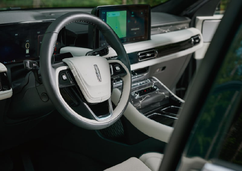The leather-trimmed steering wheel of a 2027 Lincoln Aviator® Black Label™ SUV. | Magic City Lincoln in Roanoke VA